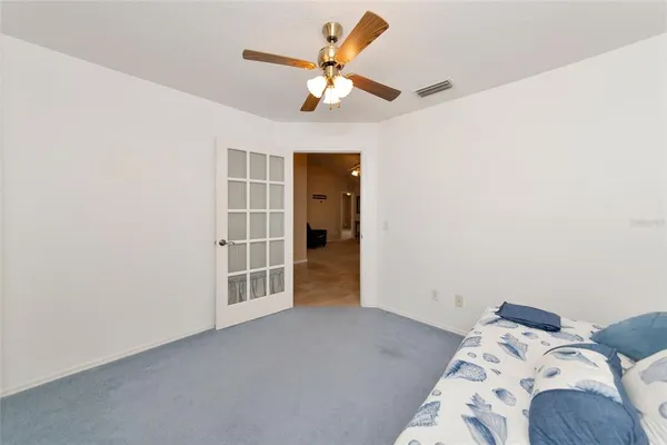 a view of a bedroom with a bed and closet