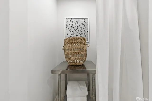 a balcony with furniture and a rug