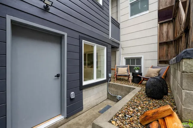 a balcony with couch and chairs