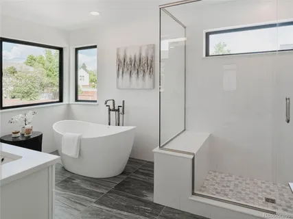 a bathroom with a bathtub and window