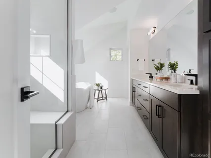 a kitchen with stainless steel appliances a sink stove and cabinets