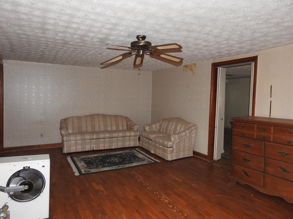 333 Lickskillet Road Epworth, GA 30541 - Photo 17 of 32 a bedroom with a bed and a dresser