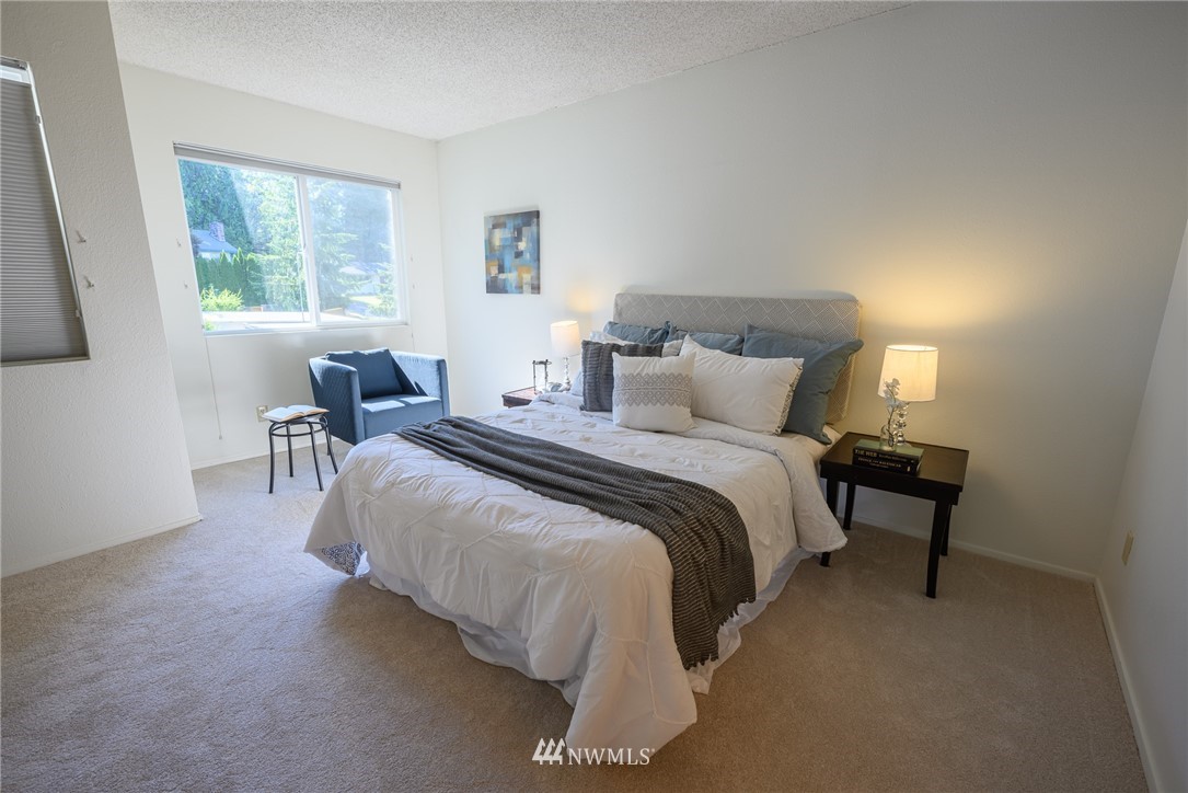 7335 Old Redmond Road, Unit 125 Redmond, WA 98052 - Photo 12 of 15 a bedroom with bed and a window