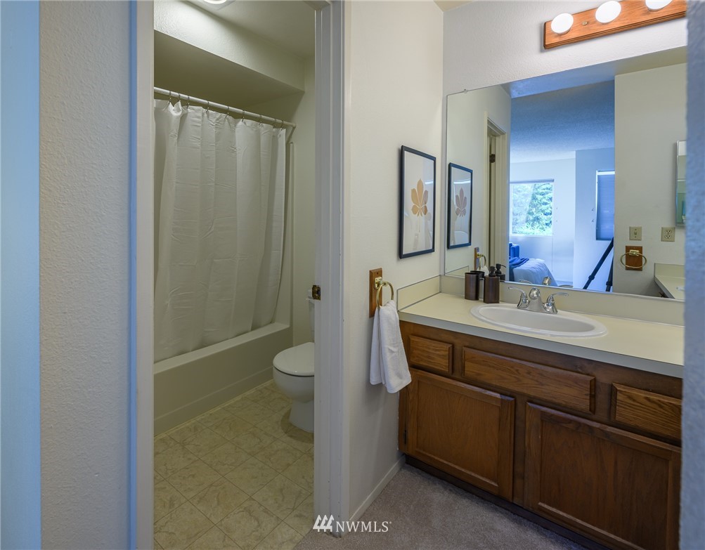 7335 Old Redmond Road, Unit 125 Redmond, WA 98052 - Photo 13 of 15 a bathroom with a sink a toilet and shower