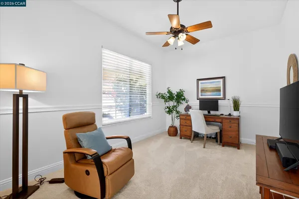 a living room with furniture and a window