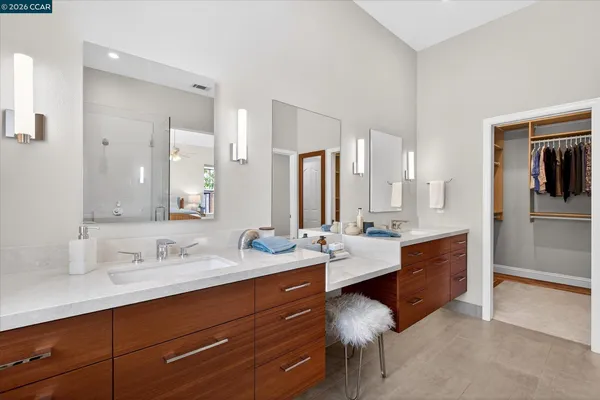 a spacious bathroom with a double vanity sink double and mirror