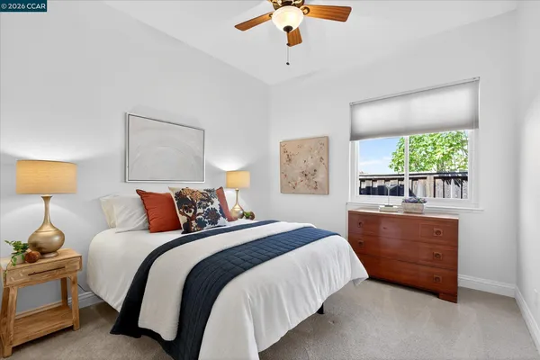 a bedroom with bed and window