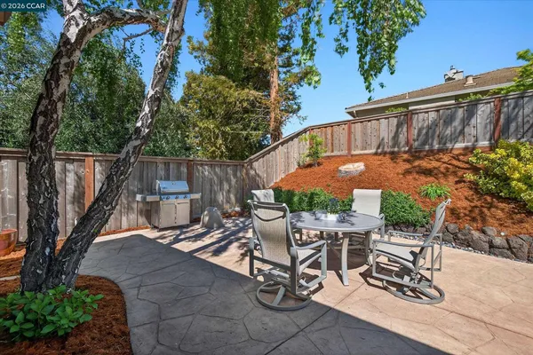 a view of a chairs with table in patio