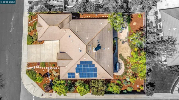 a view of a house with roof deck front of house
