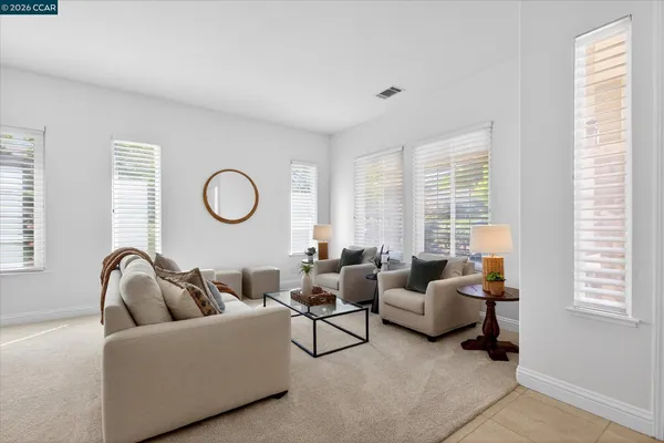 a living room with furniture and a large window