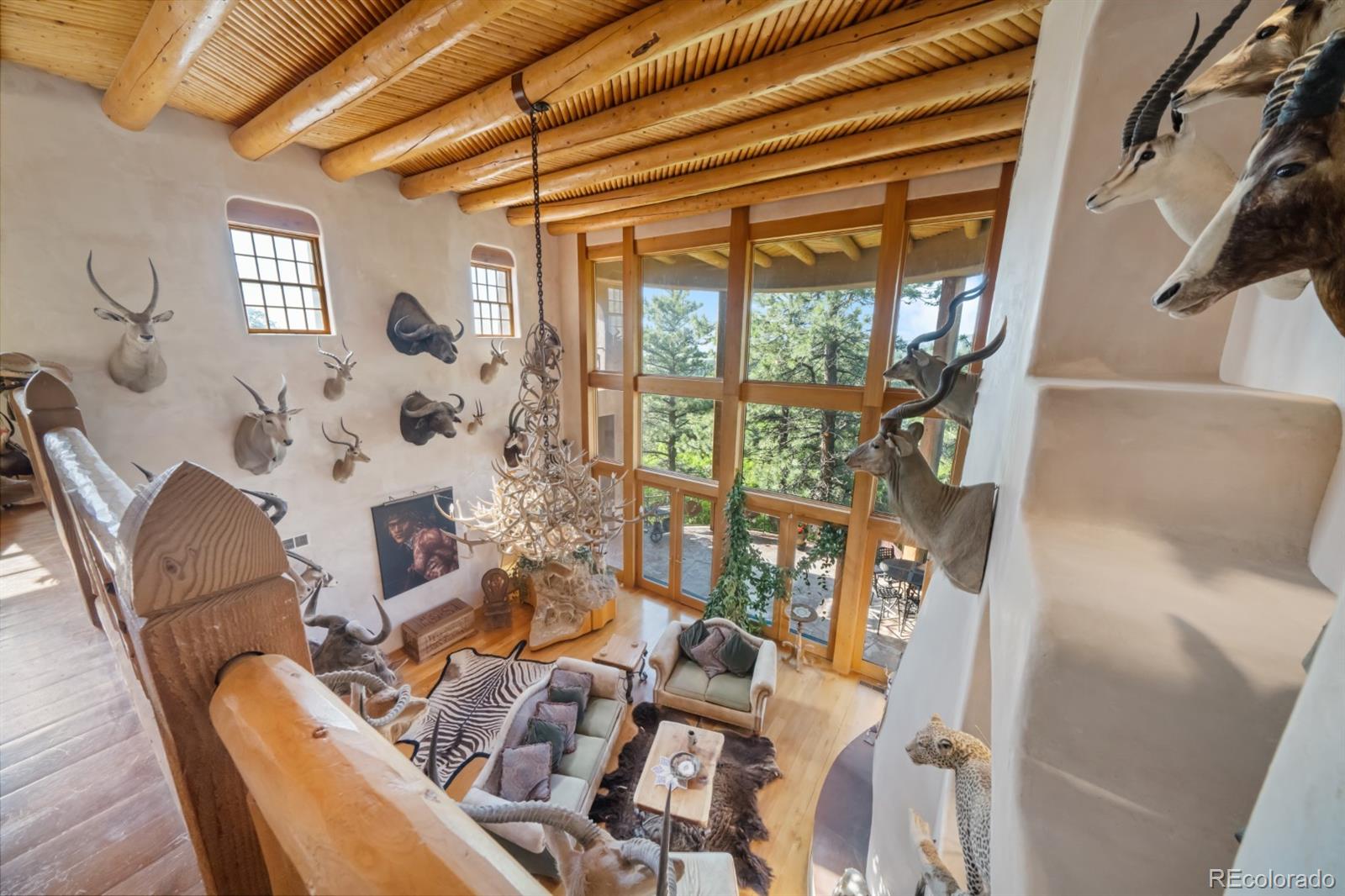 8221 Cuerna Verde Road Rye, CO 81069 - Photo 17 of 50 a living room with furniture and a large window