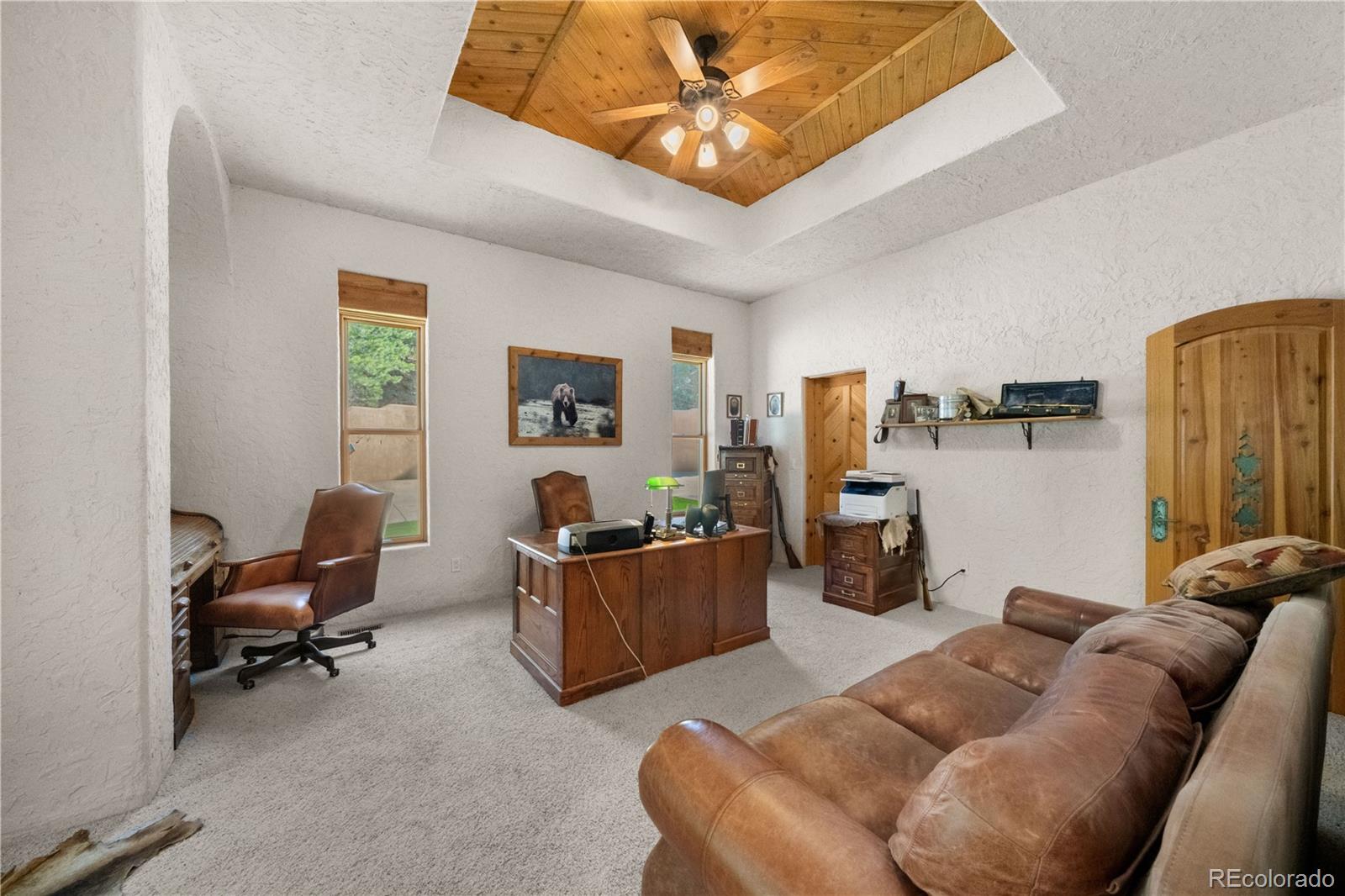 8221 Cuerna Verde Road Rye, CO 81069 - Photo 28 of 50 a living room with furniture and a flat screen tv