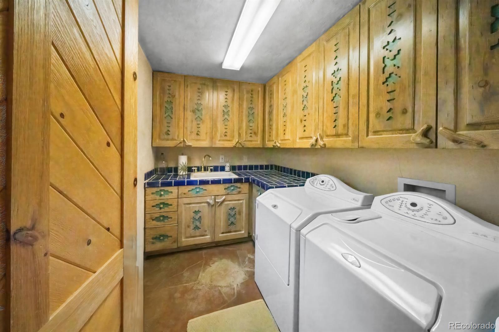 8221 Cuerna Verde Road Rye, CO 81069 - Photo 29 of 50 a utility room with dryer and washer