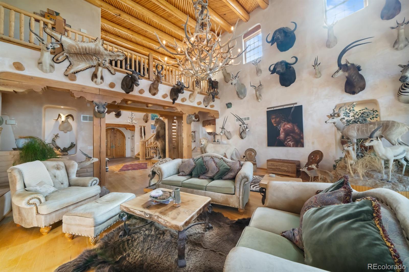 8221 Cuerna Verde Road Rye, CO 81069 - Photo 8 of 50 a living room with furniture and a fireplace