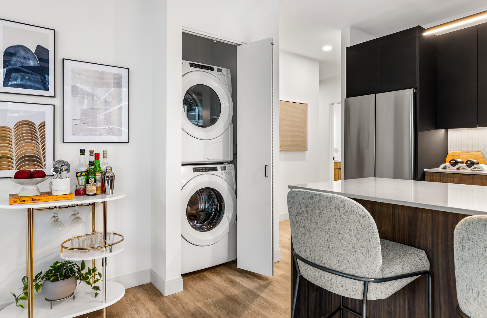 218 East Grand Avenue, Unit 1205 Chicago, IL 60611 - Photo 12 of 20 a living room with furniture a flat screen tv and a refrigerator