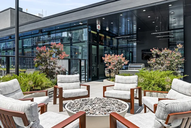 a kitchen with a sink and chairs