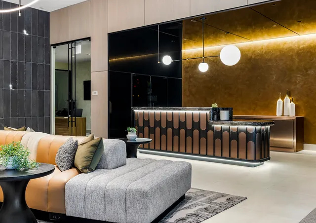 a balcony with furniture and potted plant