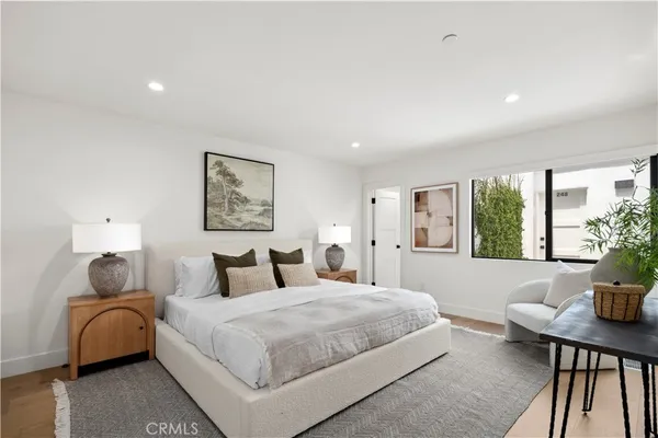 a bedroom with a large bed and a couch