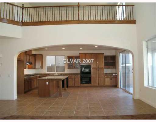 696 Blue Crystal Cree Road Henderson, NV 89002 - Photo 7 of 8 Kitchen. LOTS OF TILE FLOORS & LOTS OF PERSONALITY.