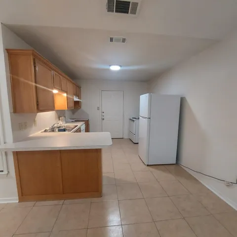 a kitchen with a cabinets and window