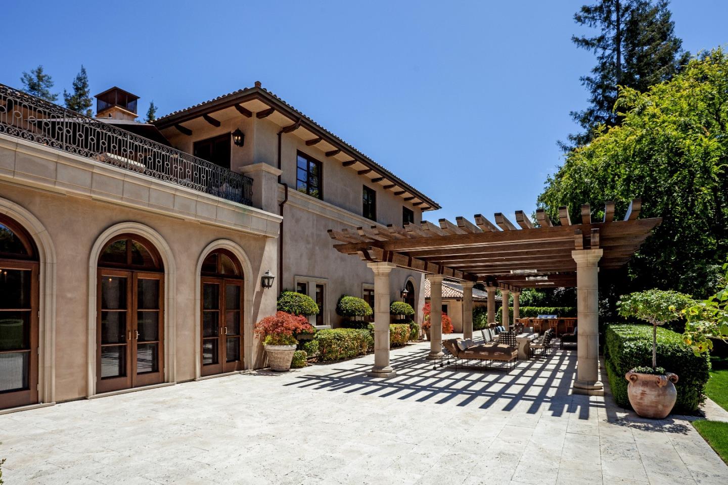 1 Faxon Road Atherton, CA 94027 - Photo 4 of 19 a view of a street with potted plants