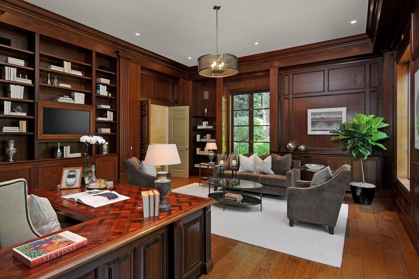 1 Faxon Road Atherton, CA 94027 - Photo 10 of 19 a living room with furniture hard wood floor and a flat screen tv
