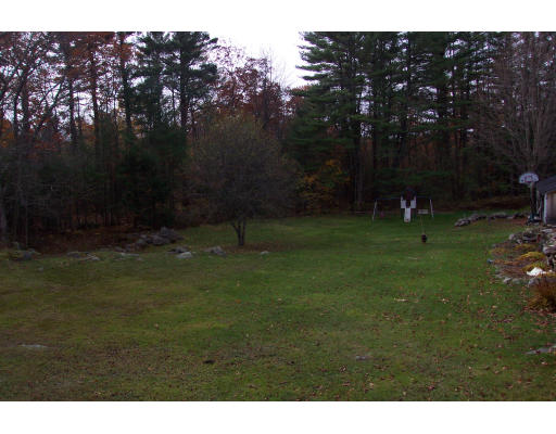 36 Healdville Road Hubbardston, MA 01452 - Photo 4 of 4 a backyard of a house with lots of green space