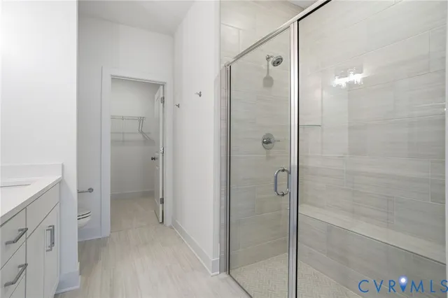 a bathroom with a shower and a sink