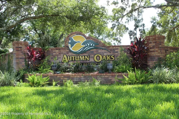 a view of outdoor space with sign board and garden