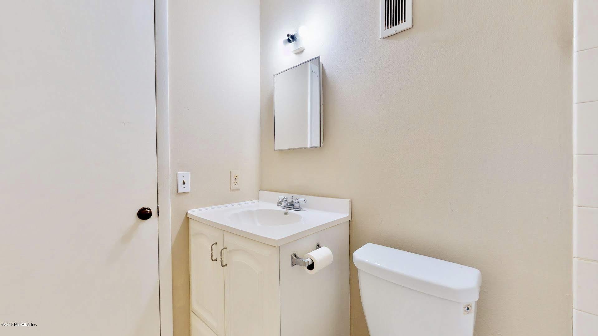 650 Pope Road, Unit 217 St. Augustine, FL 32080 - Photo 14 of 25 a white toilet sitting next to a bathroom sink