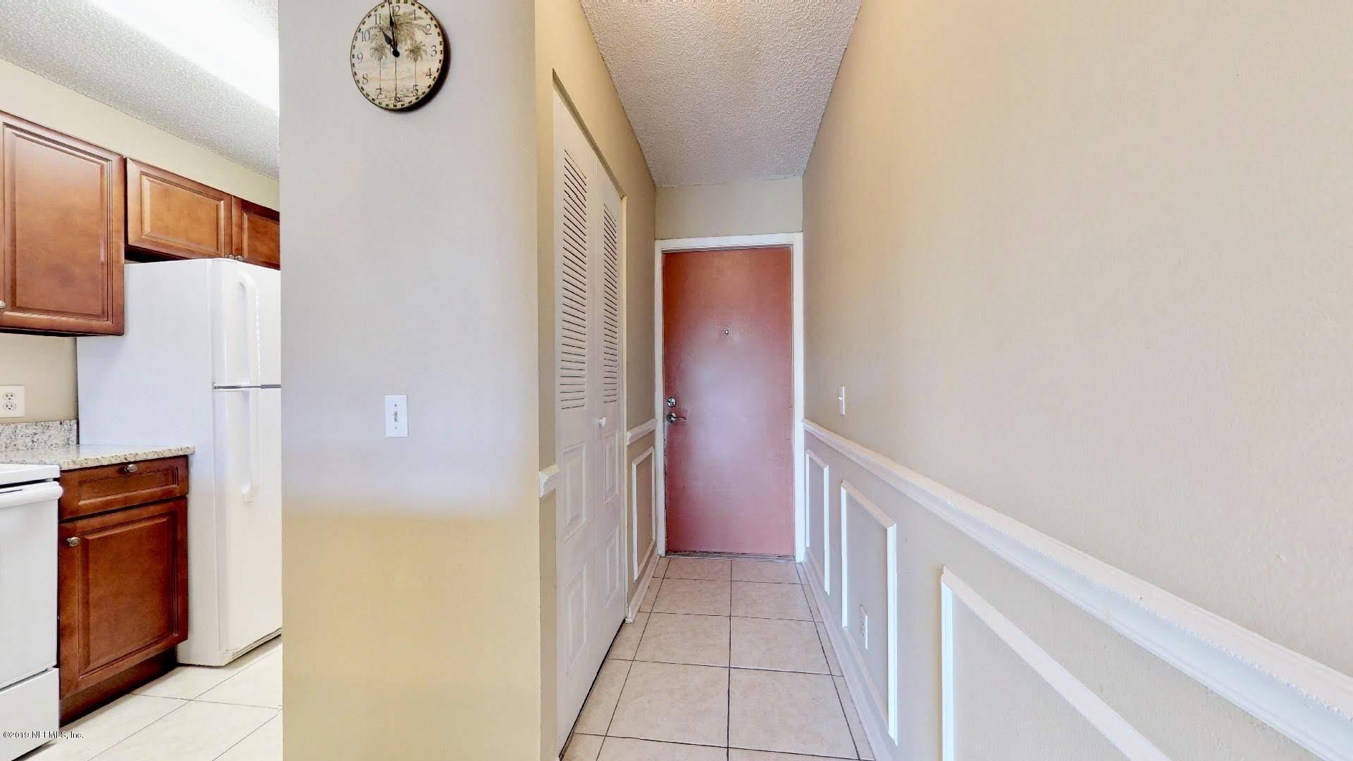 650 Pope Road, Unit 217 St. Augustine, FL 32080 - Photo 24 of 25 a view of hallway with washer and dryer