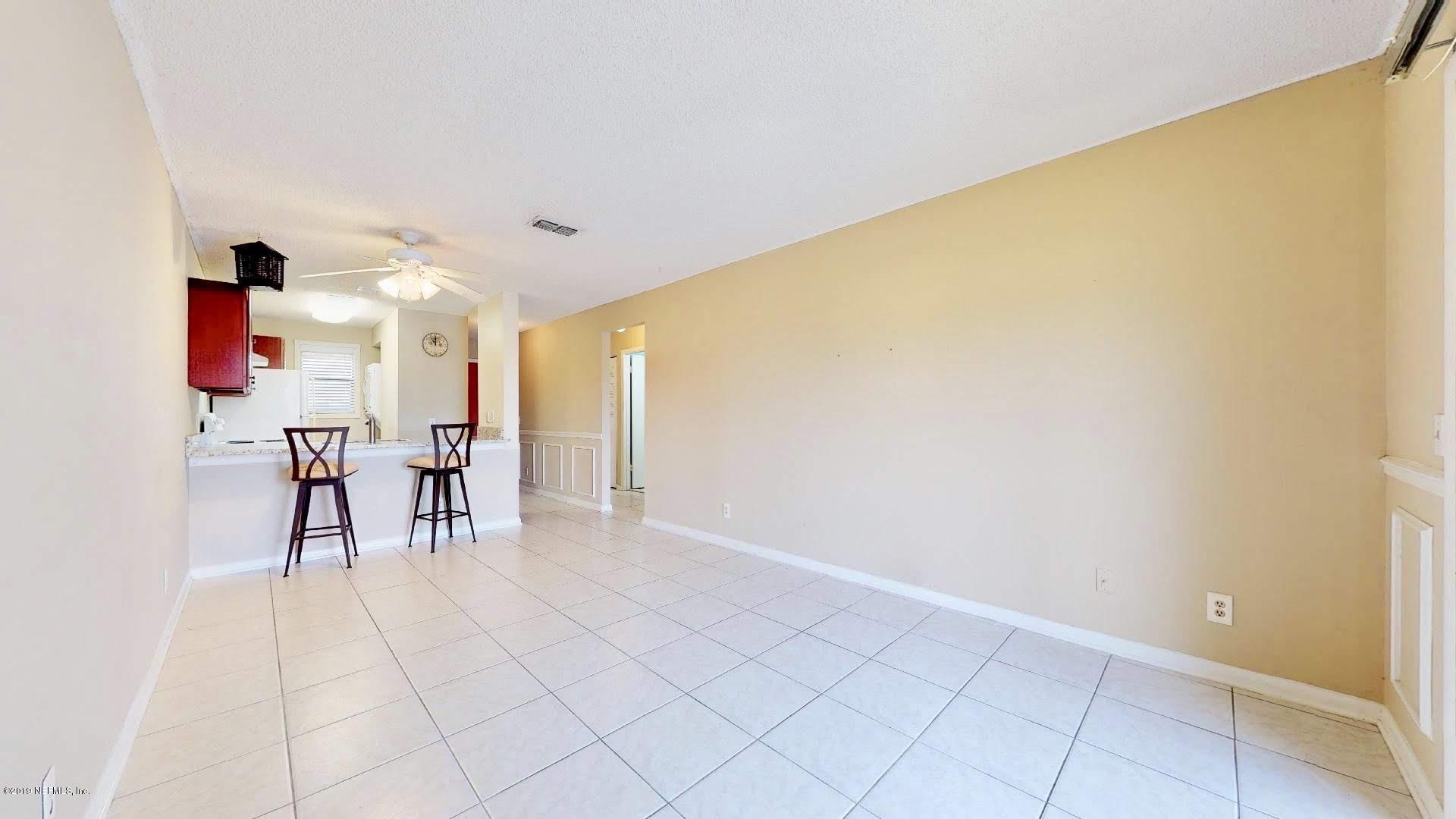 650 Pope Road, Unit 217 St. Augustine, FL 32080 - Photo 5 of 25 a view of dining room with furniture and a window