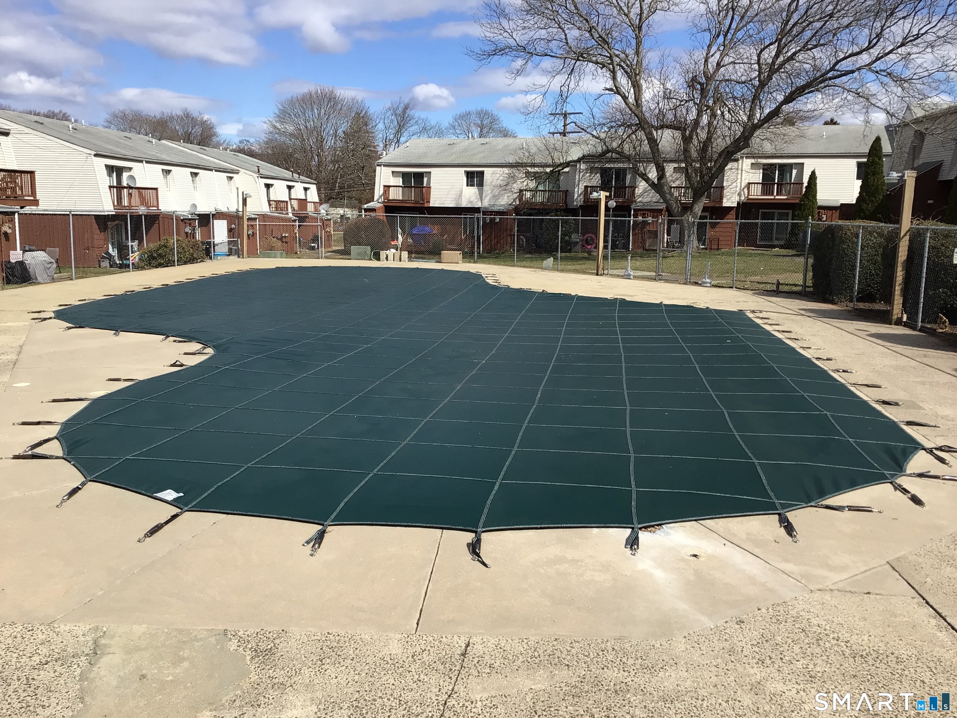 330 Short Beach Road, Unit G12 East Haven, CT 06512 - Photo 14 of 22 a view of a swimming pool with a patio