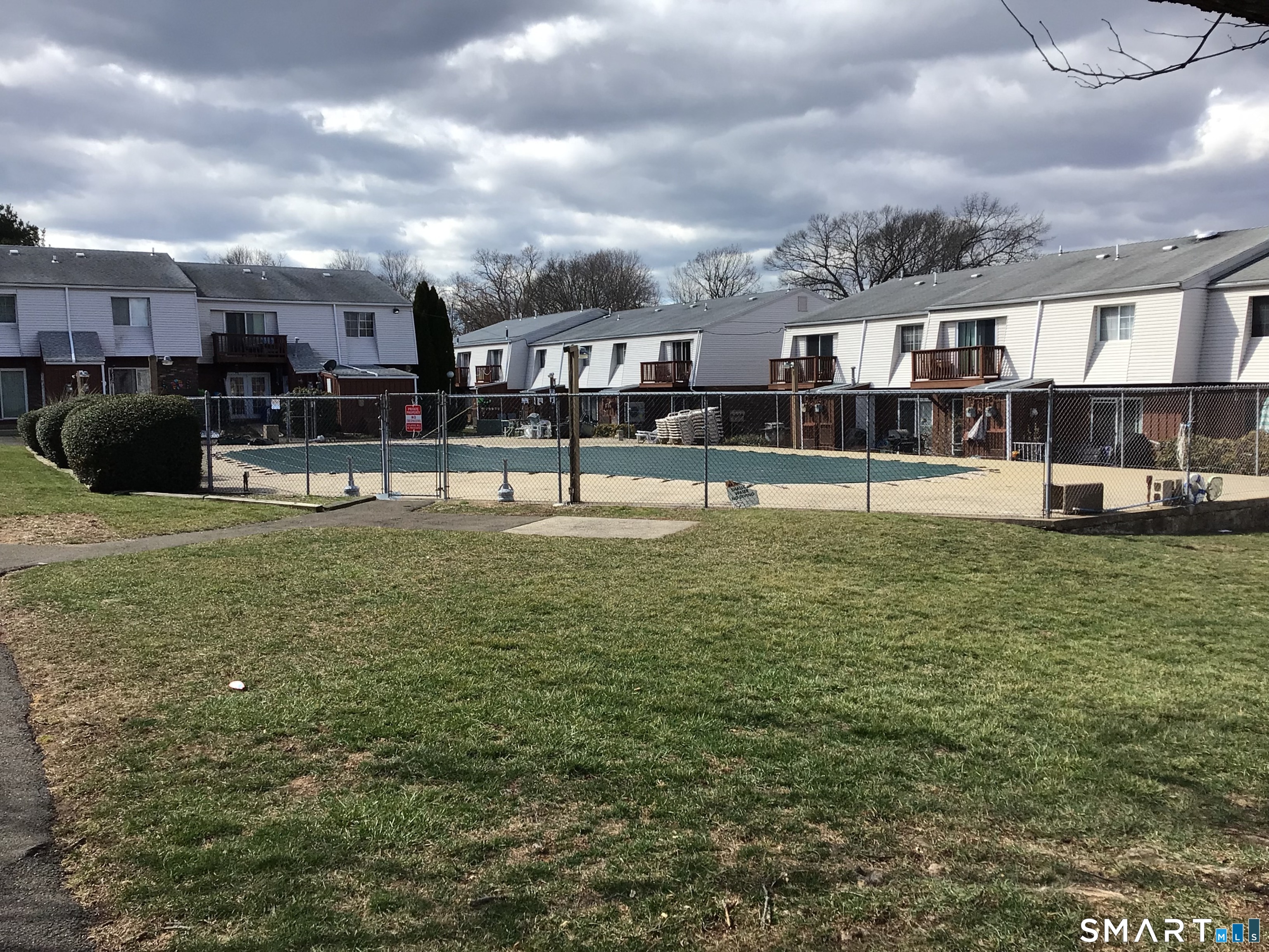 330 Short Beach Road, Unit G12 East Haven, CT 06512 - Photo 15 of 22 a swimming pool view with a outdoor seating