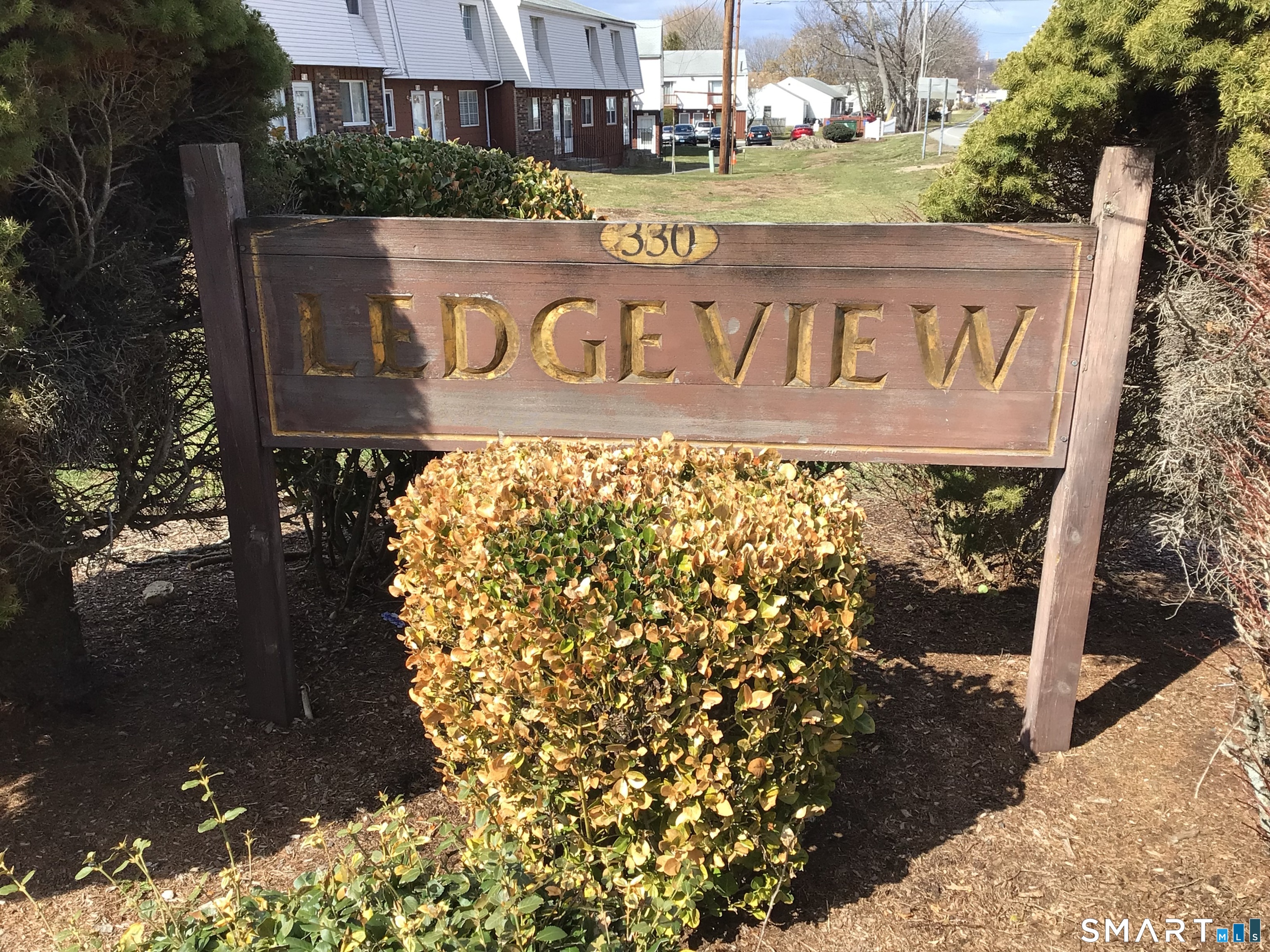 330 Short Beach Road, Unit G12 East Haven, CT 06512 - Photo 22 of 22 a view of outdoor space with signage and flags