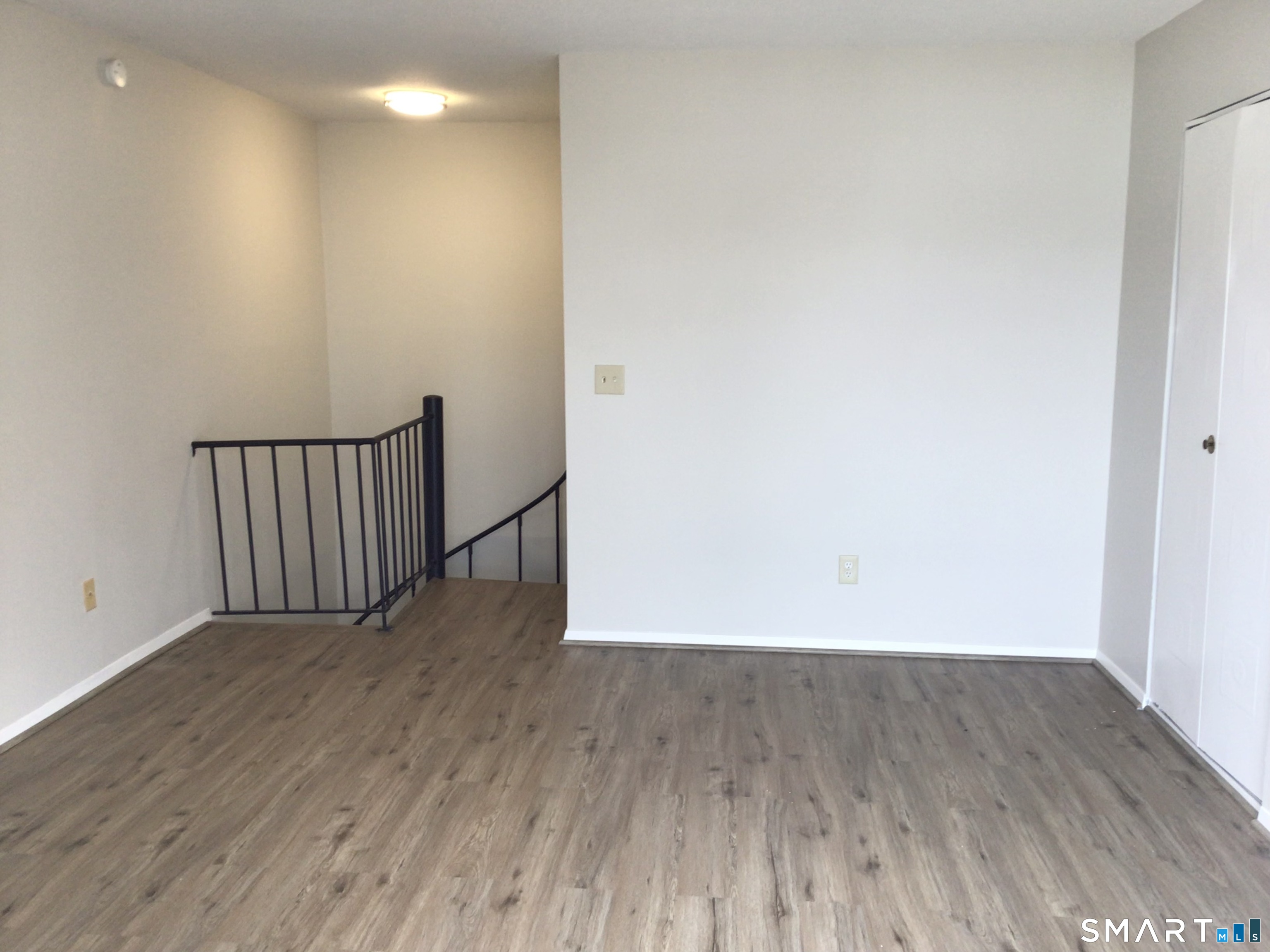 330 Short Beach Road, Unit G12 East Haven, CT 06512 - Photo 10 of 22 a view of wooden floor in a room