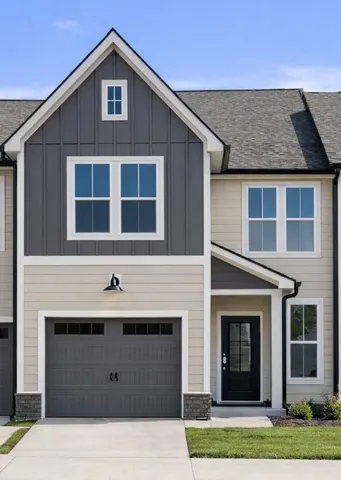 a front view of a house with yard