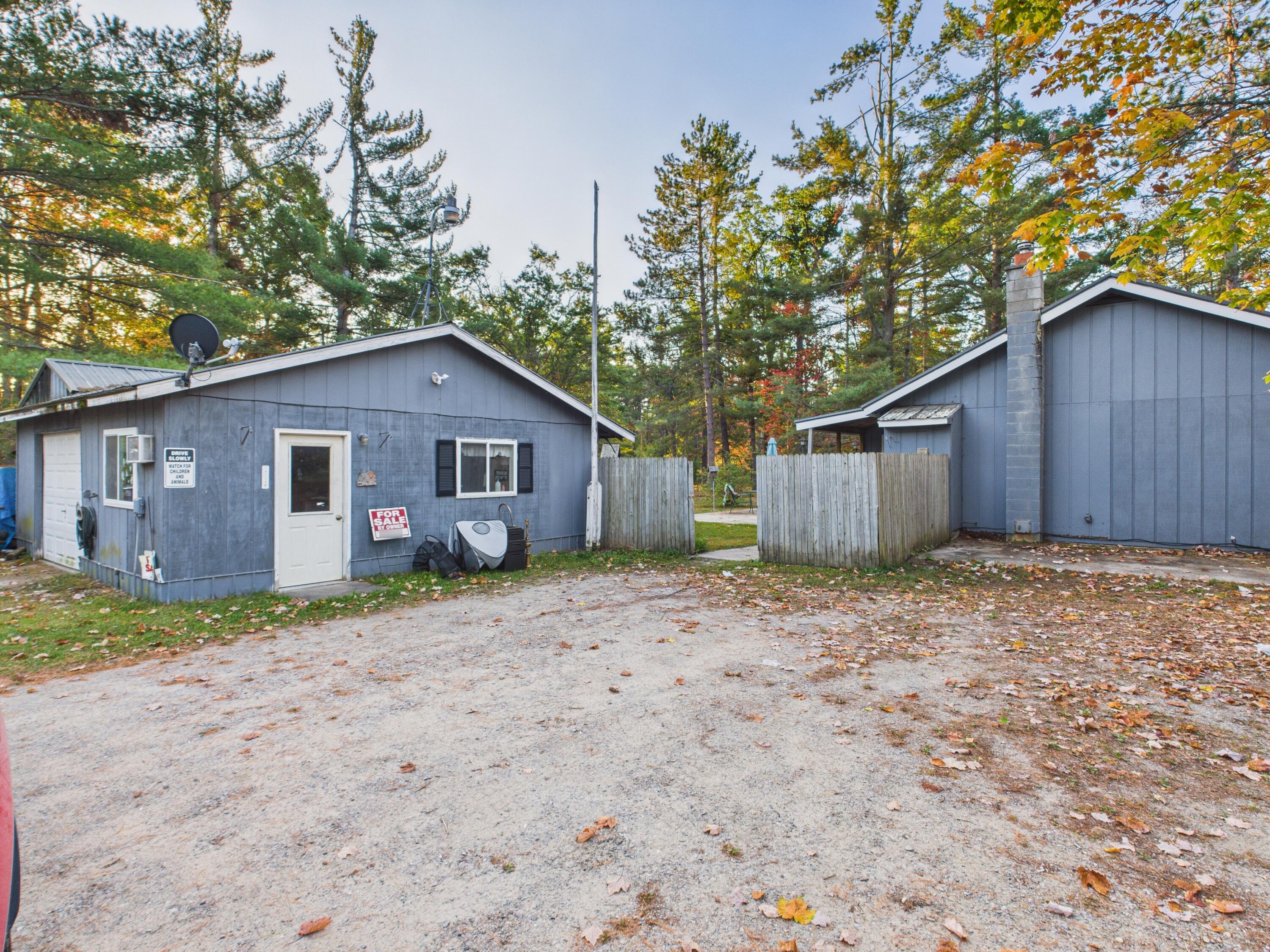 5744 North Red Oak Road Lewiston, MI 49756 - Photo 22 of 22 side of home and garage