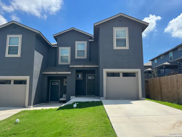 a view of an house with backyard and bathroom
