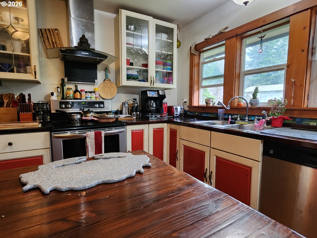 45366 Highway 101 Sixes, OR 97476 - Photo 19 of 34 a kitchen with a stove and a sink