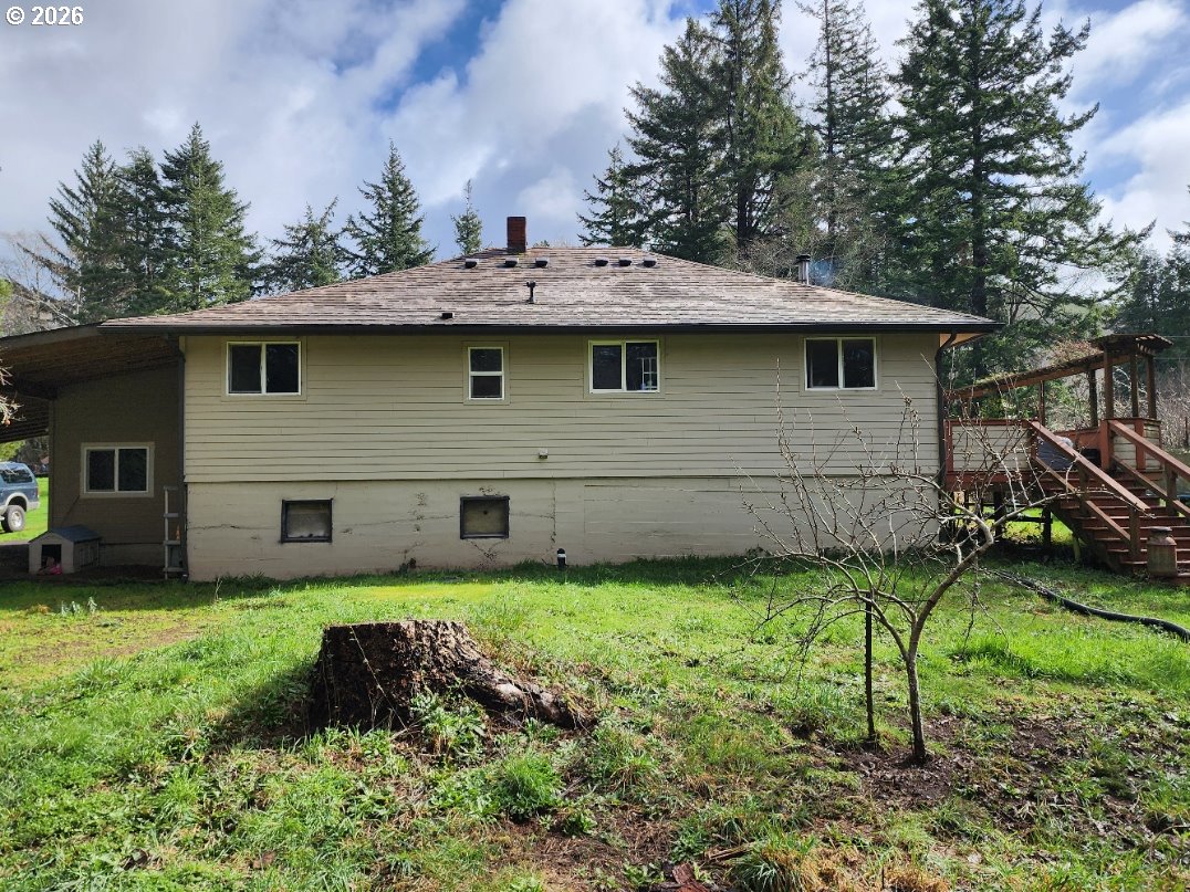 45366 Highway 101 Sixes, OR 97476 - Photo 25 of 34 a view of a backyard with a garden and plants