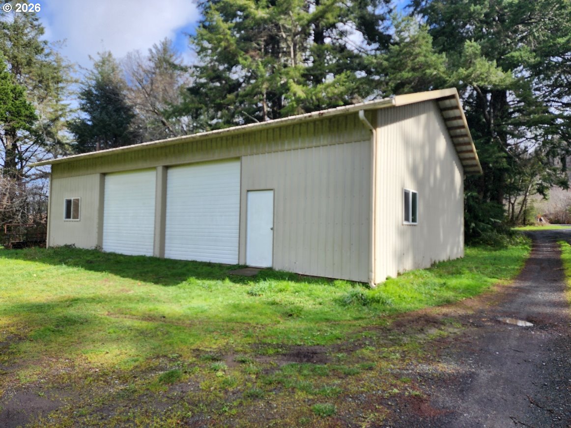 45366 Highway 101 Sixes, OR 97476 - Photo 34 of 34 a backyard of a house with lots of green space