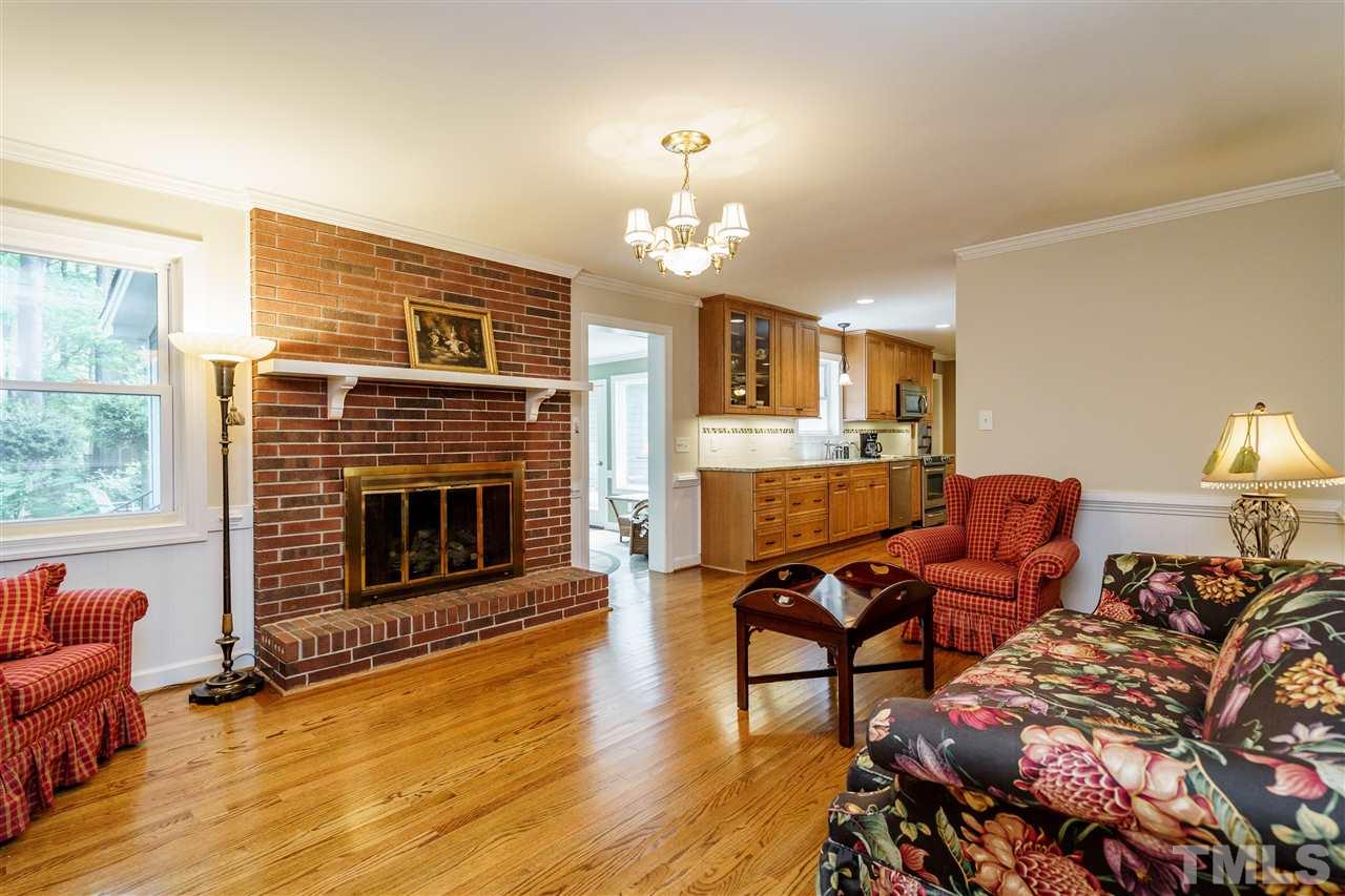 6512 King Lawrence Road Raleigh, NC 27607 - Photo 14 of 30 a living room with furniture and a fireplace
