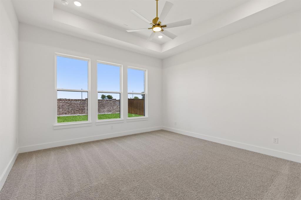 2540 Harpole Road Prosper, TX 75078 - Photo 10 of 19 Located at the rear of the home for additional privacy, this owner's suite was designed for rest and relaxation!