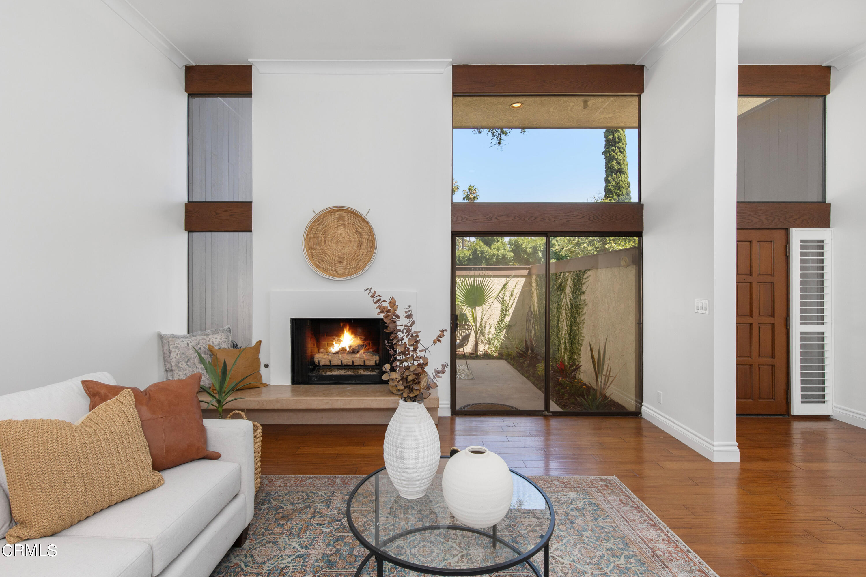 1 South Orange Grove Boulevard, Unit 12 Pasadena, CA 91105 - Photo 2 of 27 a living room with furniture and a wooden floor