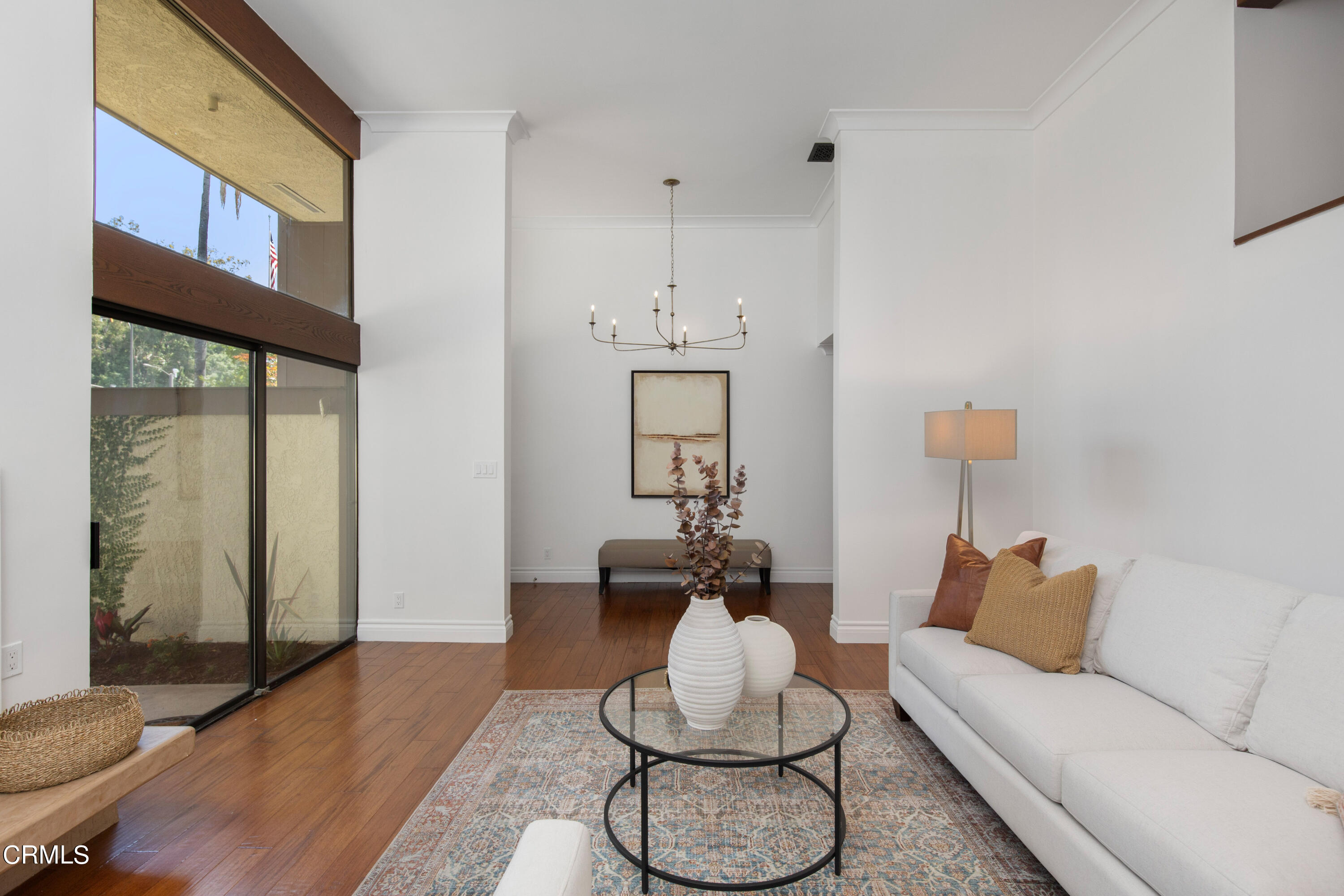1 South Orange Grove Boulevard, Unit 12 Pasadena, CA 91105 - Photo 3 of 27 a living room with furniture and wooden floor