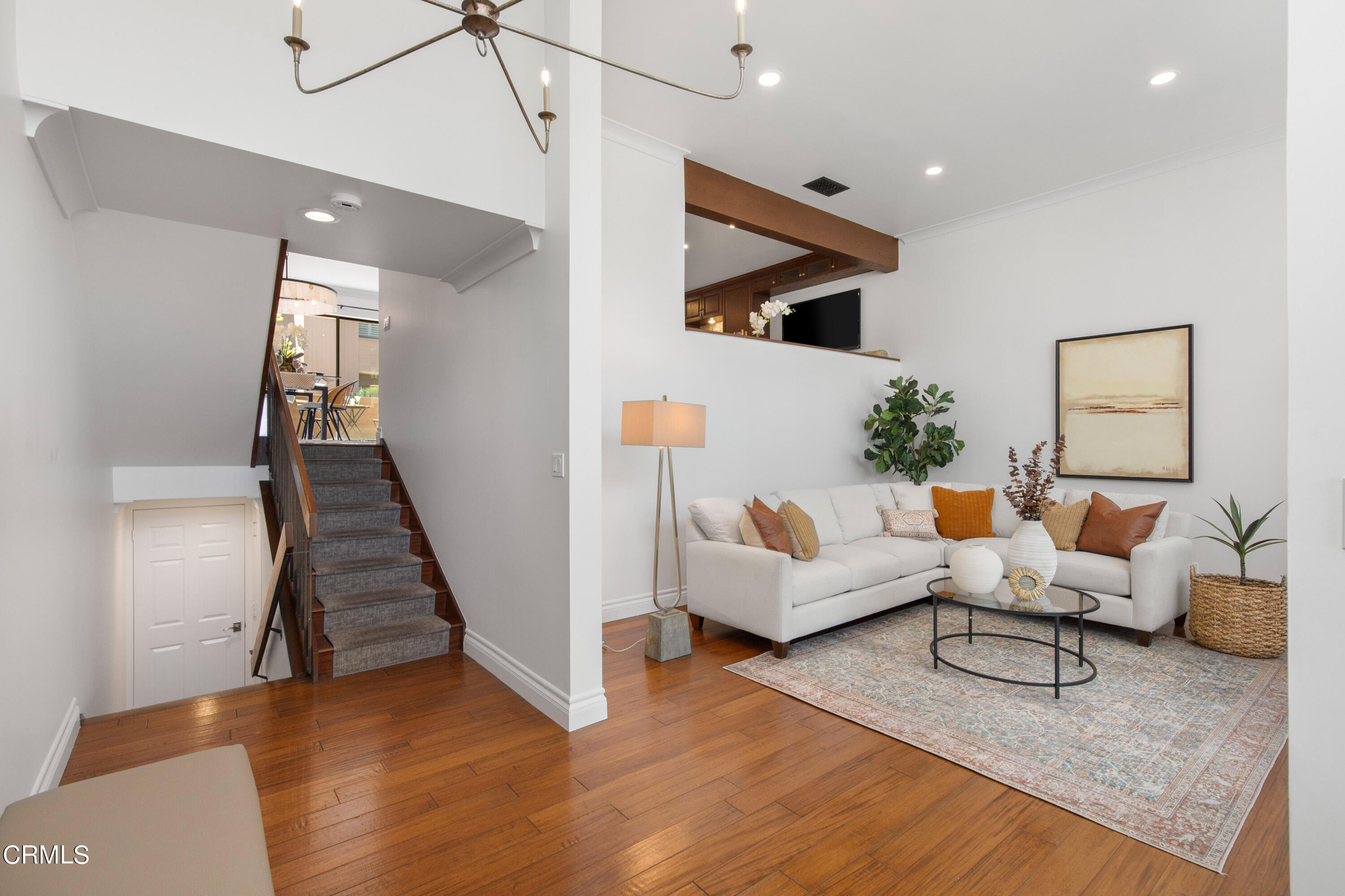 1 South Orange Grove Boulevard, Unit 12 Pasadena, CA 91105 - Photo 4 of 27 a living room with furniture and wooden floor