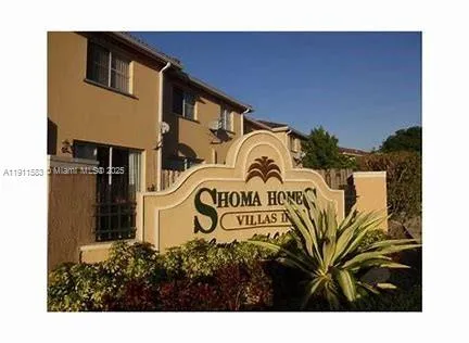 a black and white photo of a house