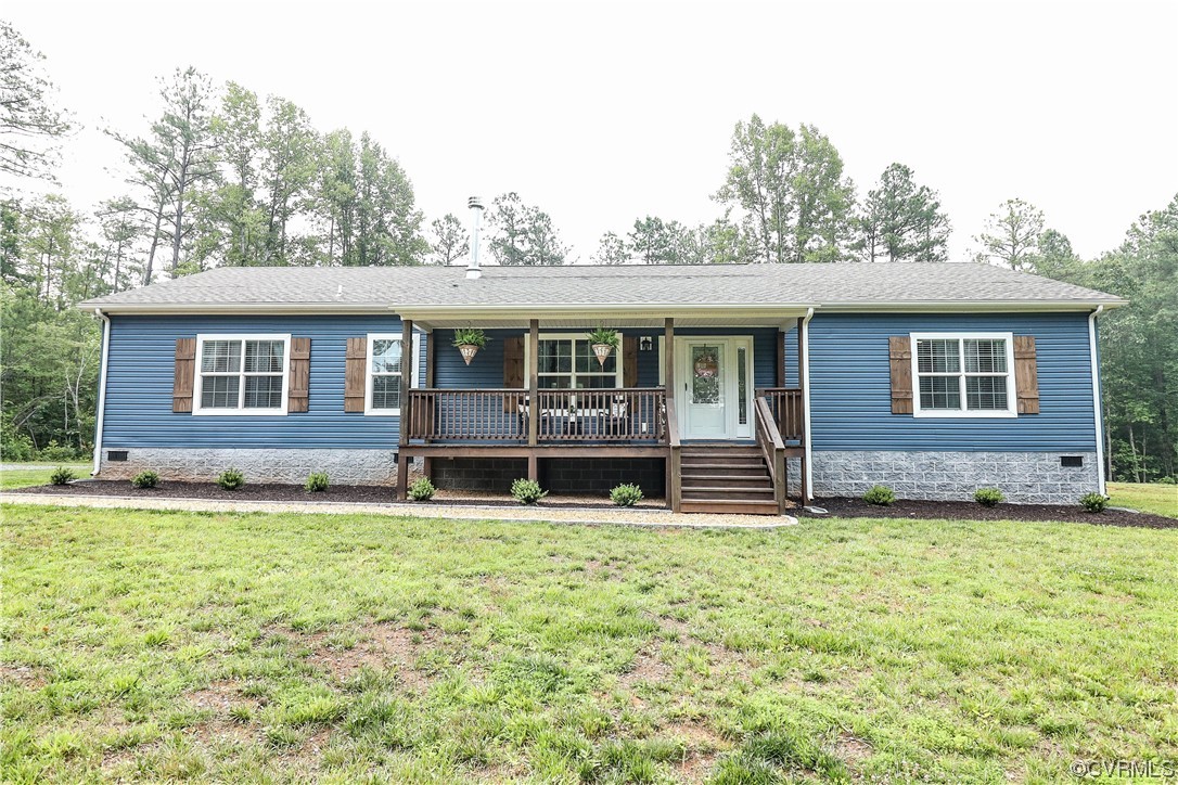 a backyard of a house with yard and outdoor seating