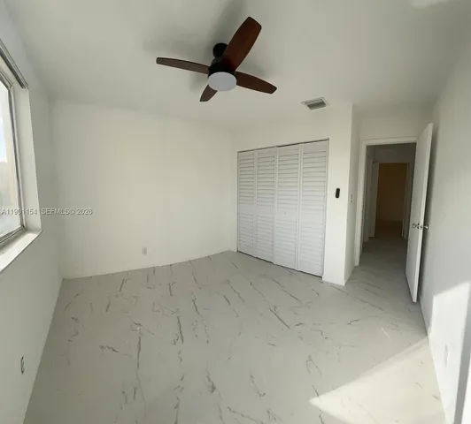 a view of a building with a yard